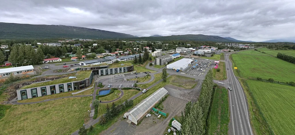 An aerial view of Egilsstaðir roads, buildings and green space