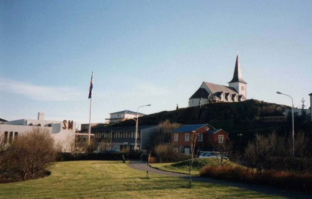 Borgarnes public park and buildings below its church